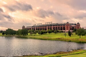 large stadium surrounded by trees